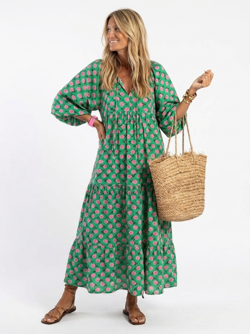 Green floral print v-neck midi dress with long puff sleeves and tiered skirt