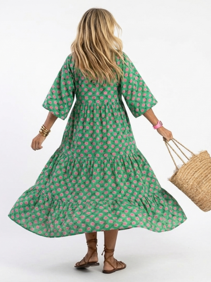 Green floral print midi dress, tiered skirt, long sleeves; view from back