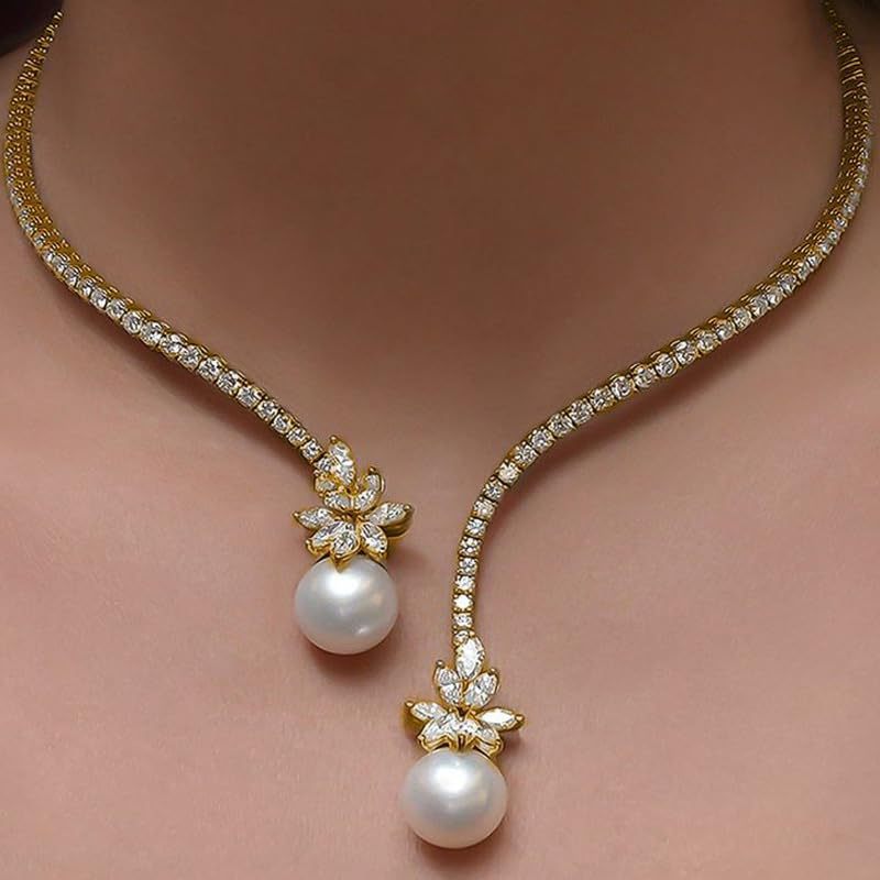 Gold-tone pearl drop necklace with star flower charms and two white pearl drops
