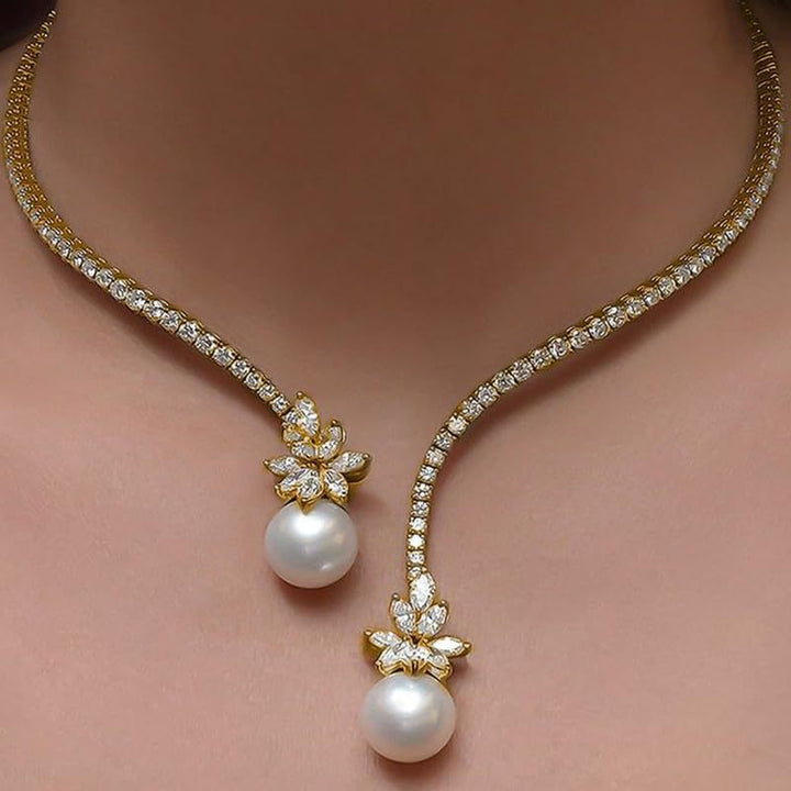 Gold-tone pearl drop necklace with star flower charms and two white pearl drops